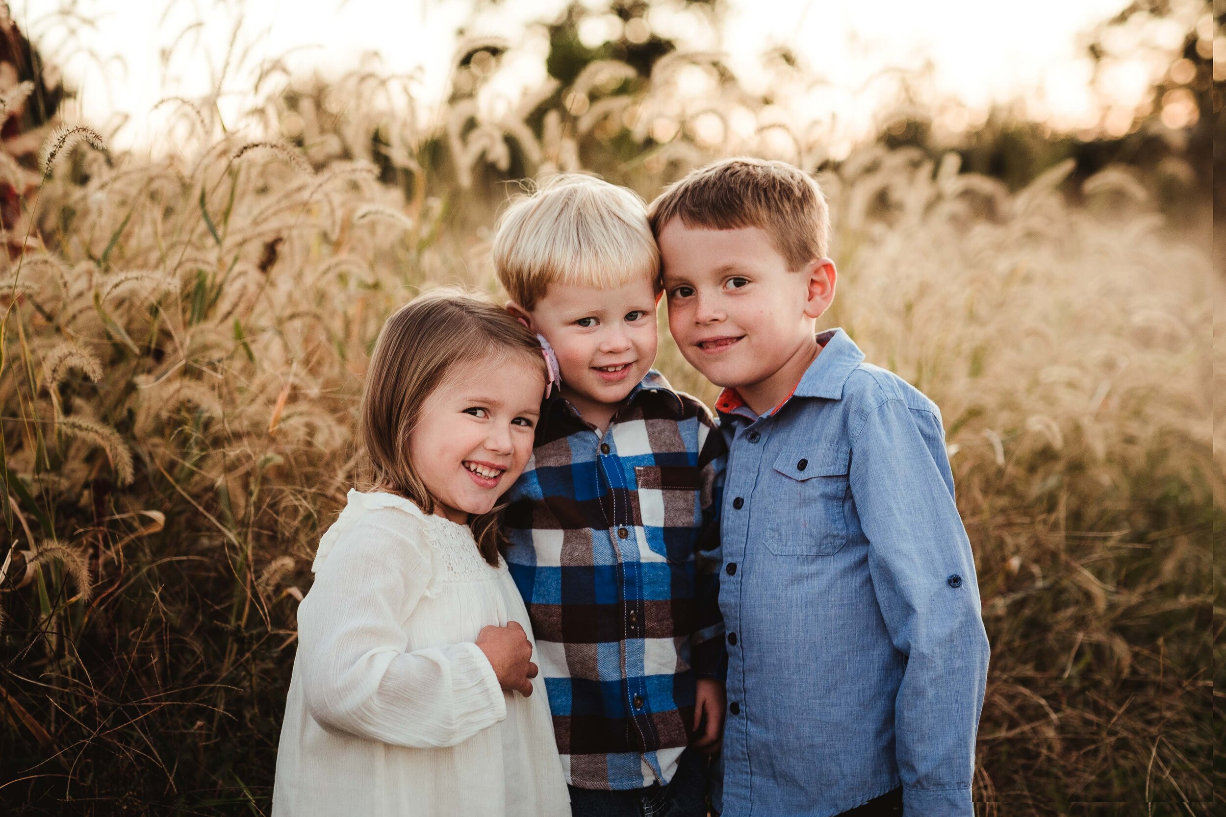 fall sibling photos with a toddler and preschooler and grade schooler in Lafayette Indiana