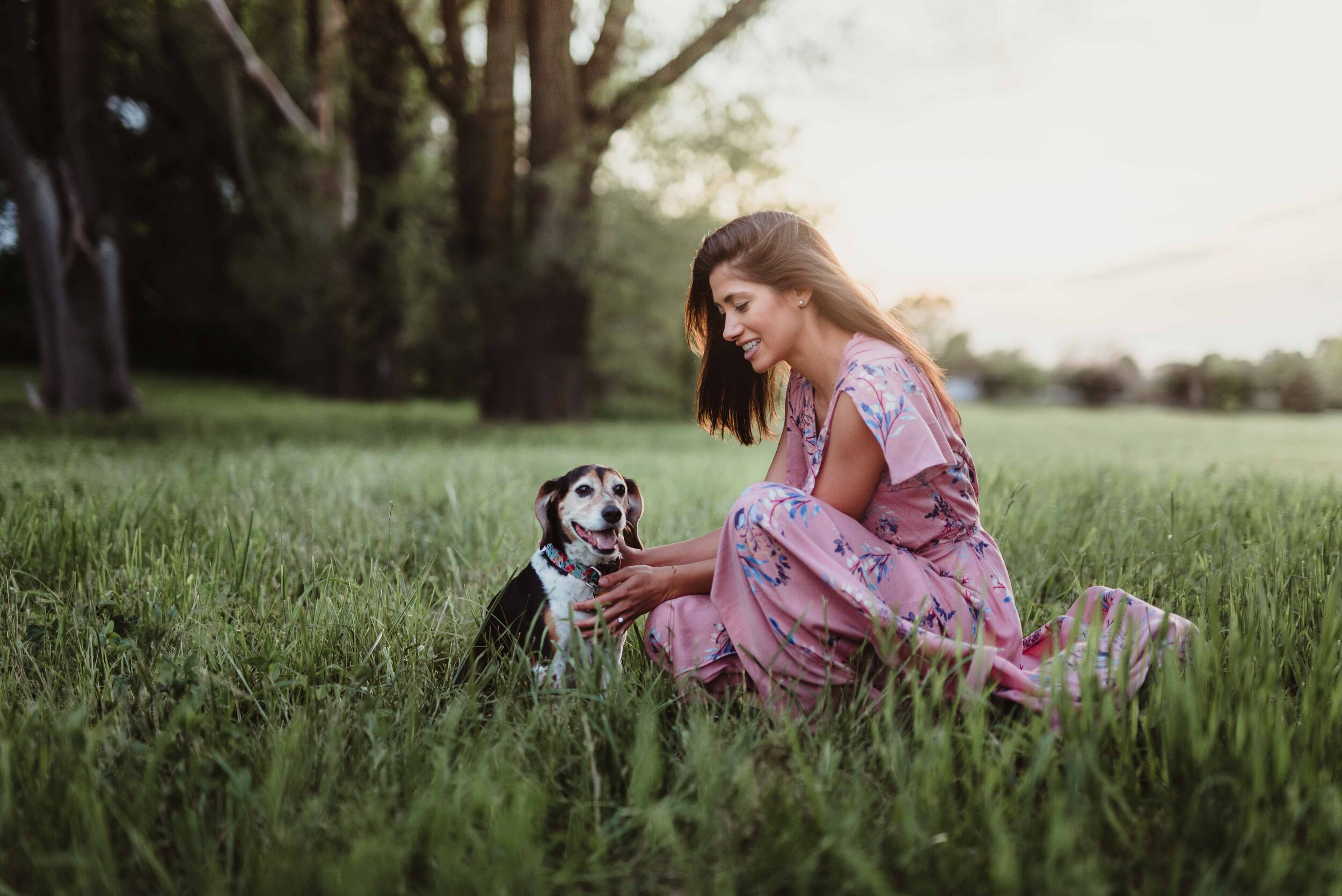 a girl and her dog during an engagement session in Lafayette, IN