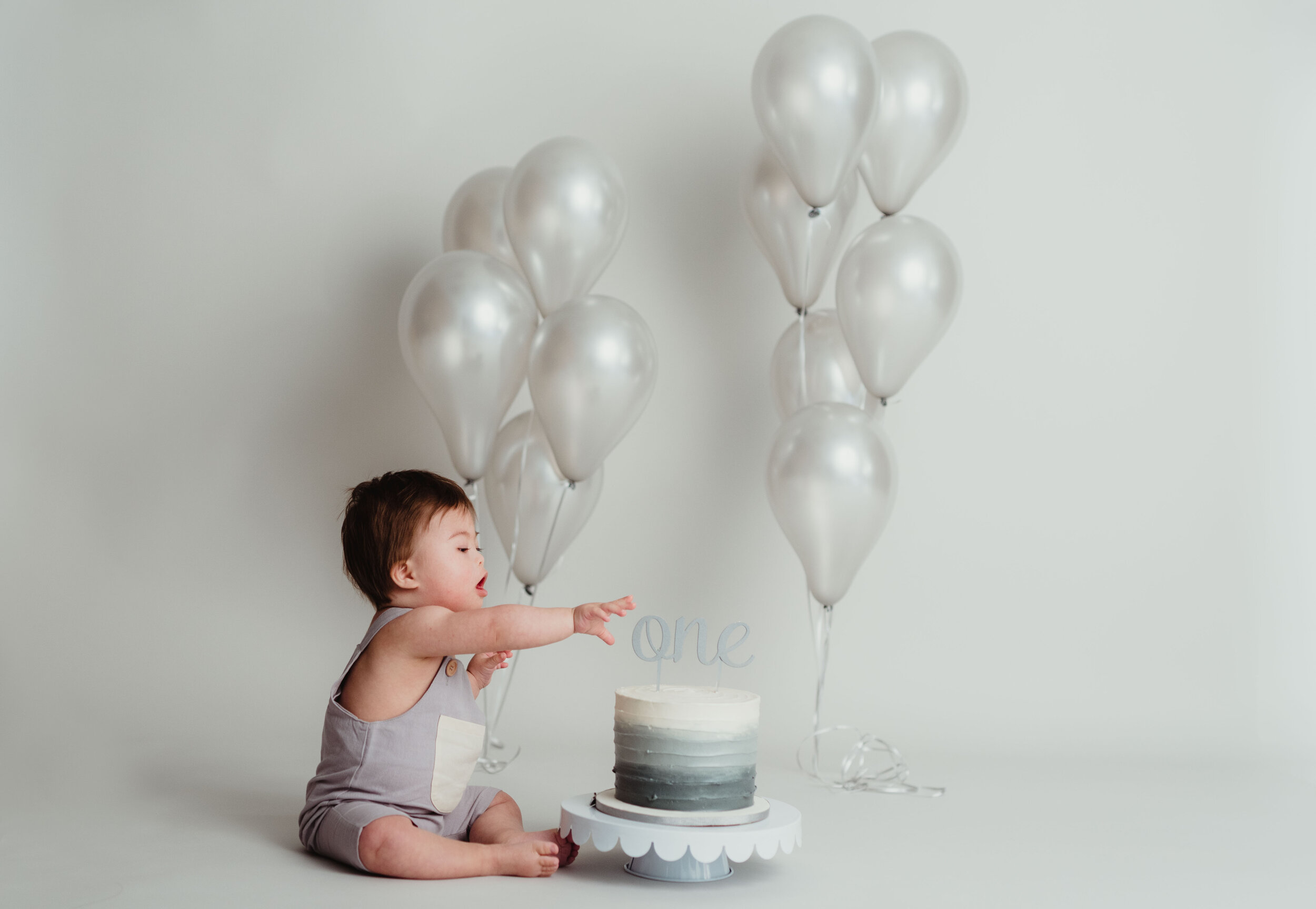 simple little boy 1st birthday cake smash gray and white 