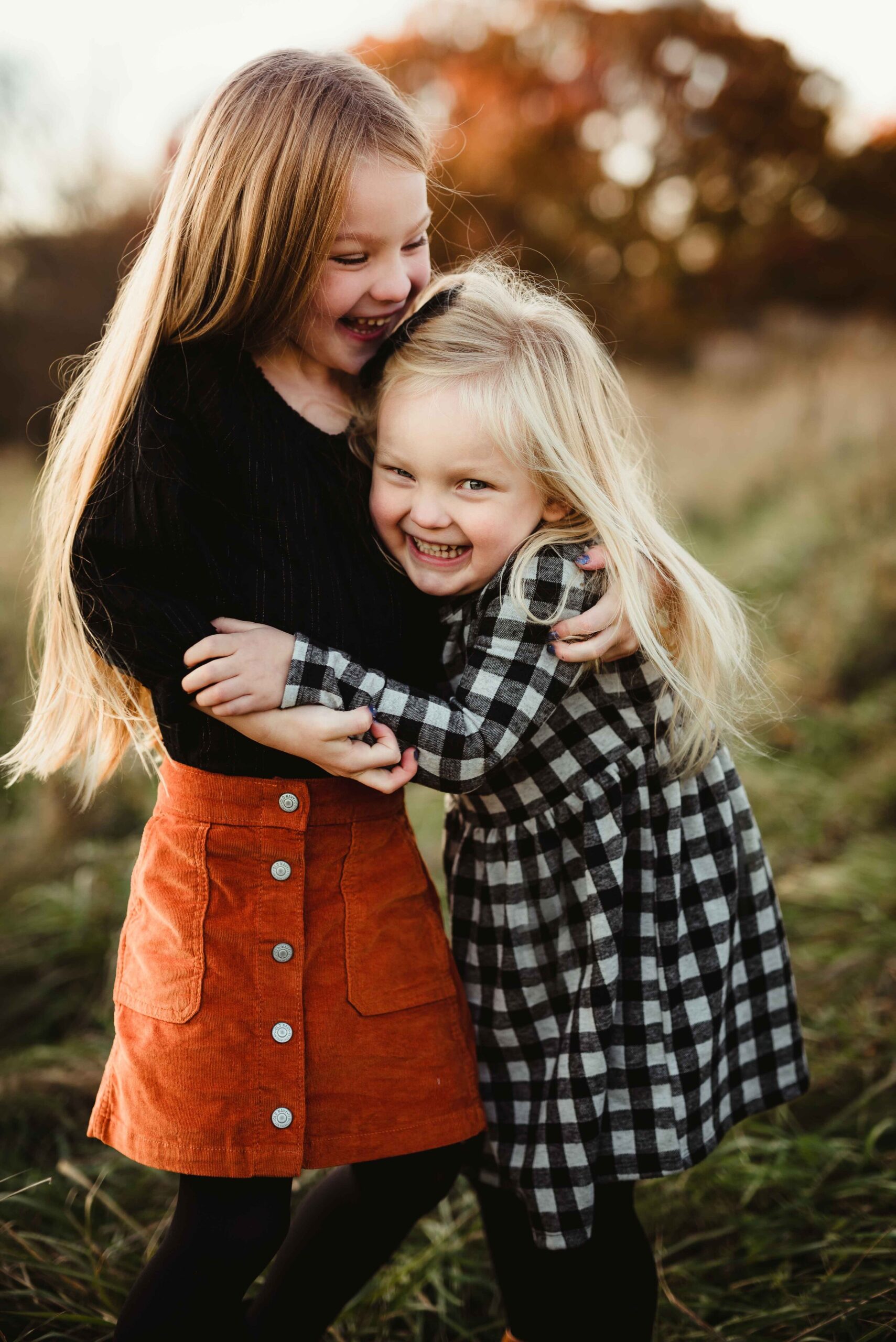 The sister tickle hug worked perfectly to get these adorable smiles!