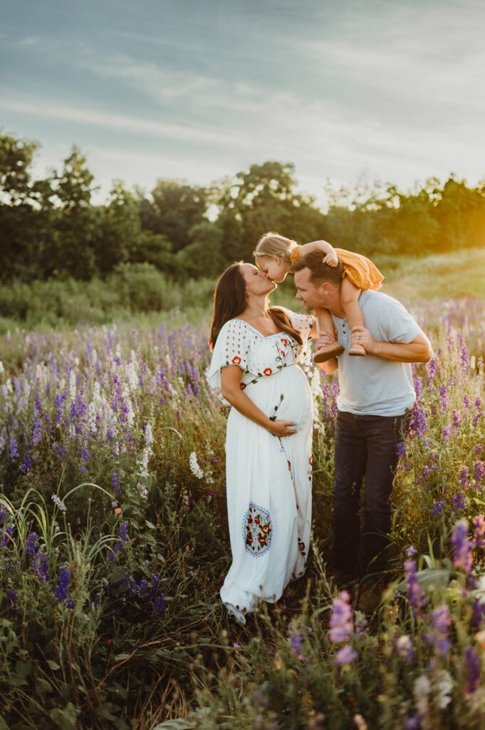 50 Must-Try Family Poses: Inside the KMP Posing Deck That Can Transform Your Sessions Expecting mother with partner and child in a lavender field, example maternity and family pose from the KMP Family Posing Guide