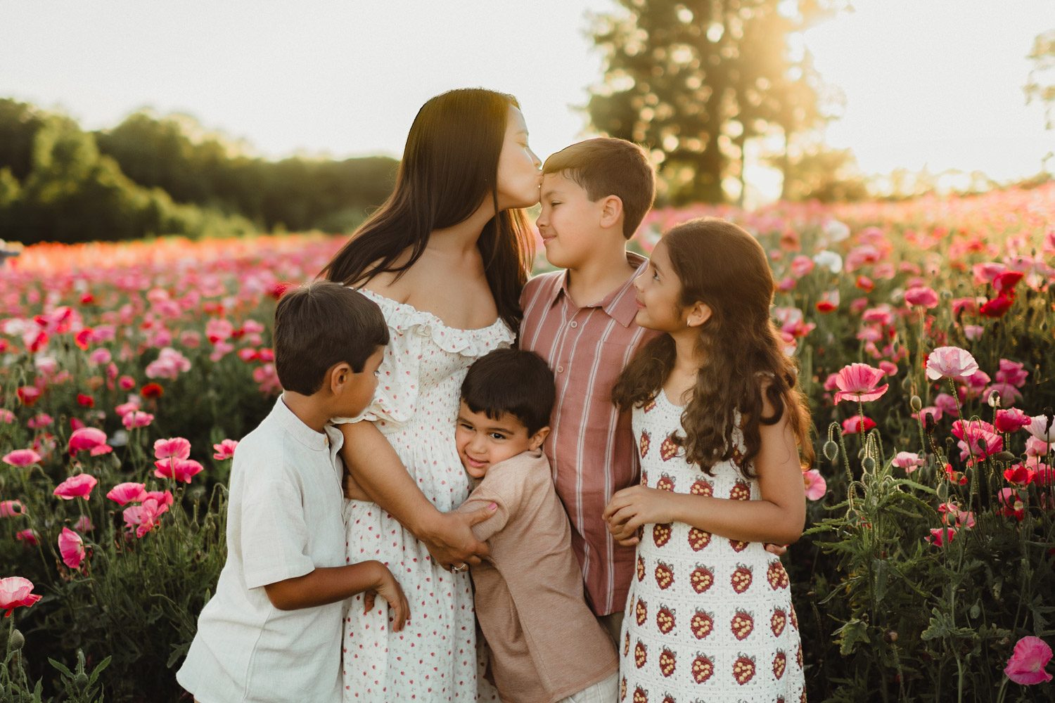 Spring Family Photography at Dogwood Farms: Wildflower Sessions in North Carolina-wildflower sessions in North Carolina North Carolina wildflower photo session featuring joyful, candid moments between mother and her children