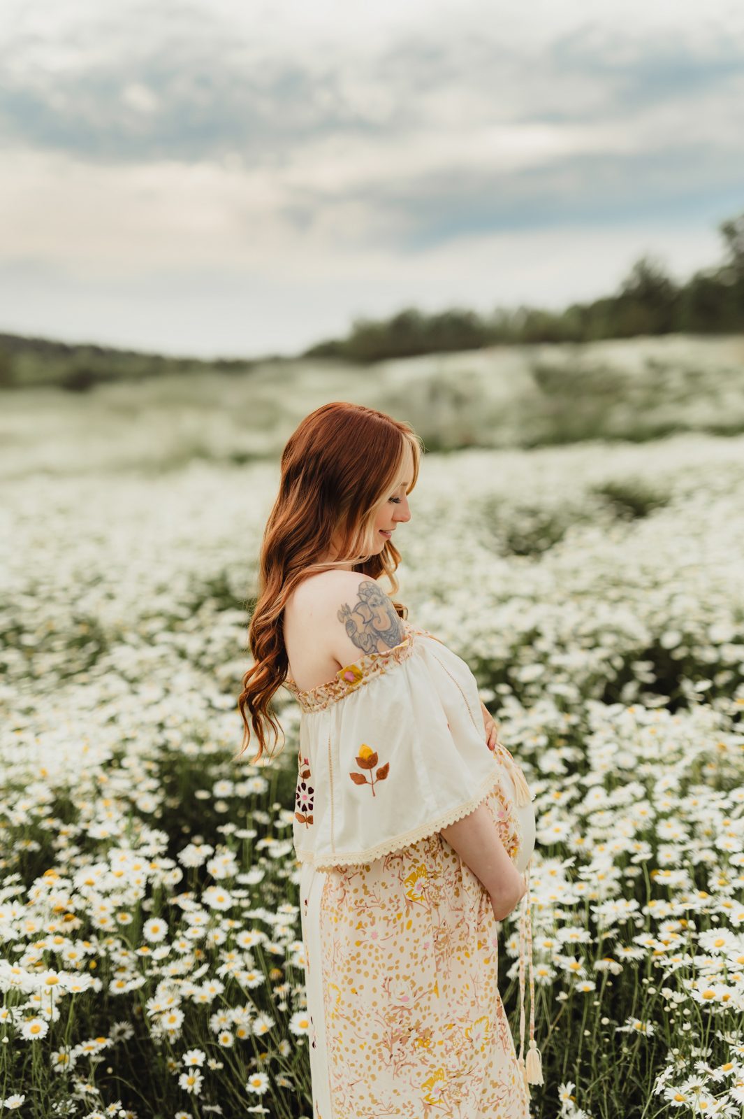 When to Take Maternity Photos (And Why It Matters!)-When to Take Maternity Photos Pregnancy photo taken at 32 weeks in a wildflower field near Greensboro NC, captured by a local maternity photographer.