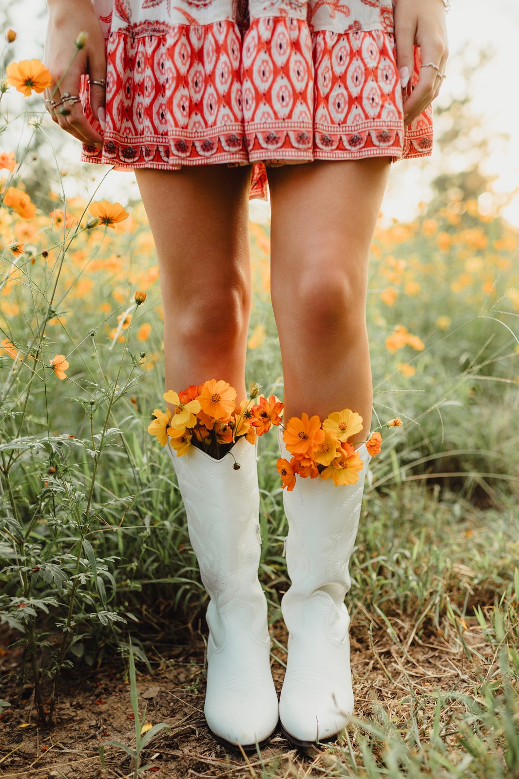 Creative senior picture idea – cowboy boots with flowers, unique senior photo detail in Greensboro NC