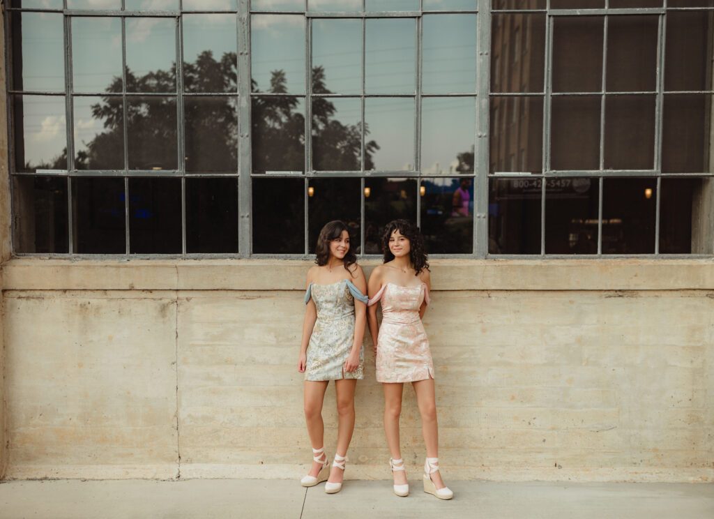 Off-the-shoulder mini dresses for senior girls during editorial-style photo session at Revolution Mill in Greensboro NC