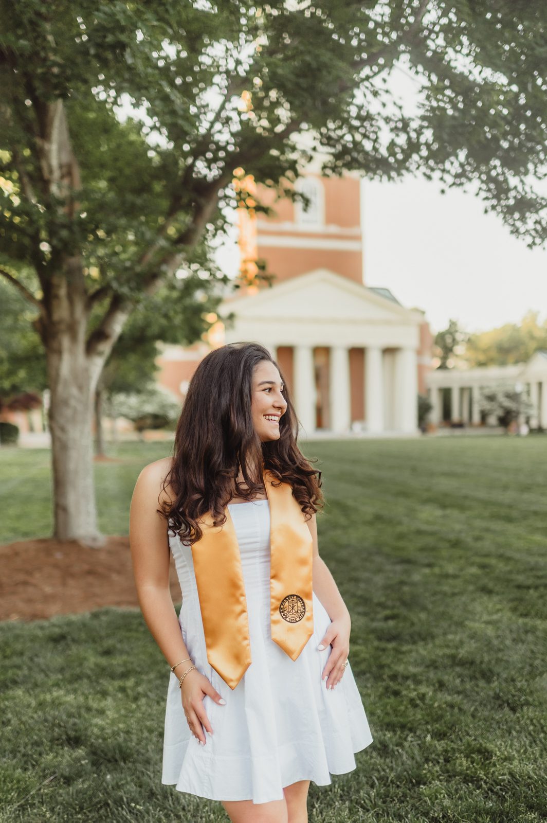 Mia laughing on the Quad at Wake Forest University during her graduation photo session