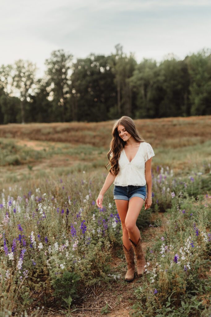 Golden hour senior photos in a North Carolina field near Greensboro